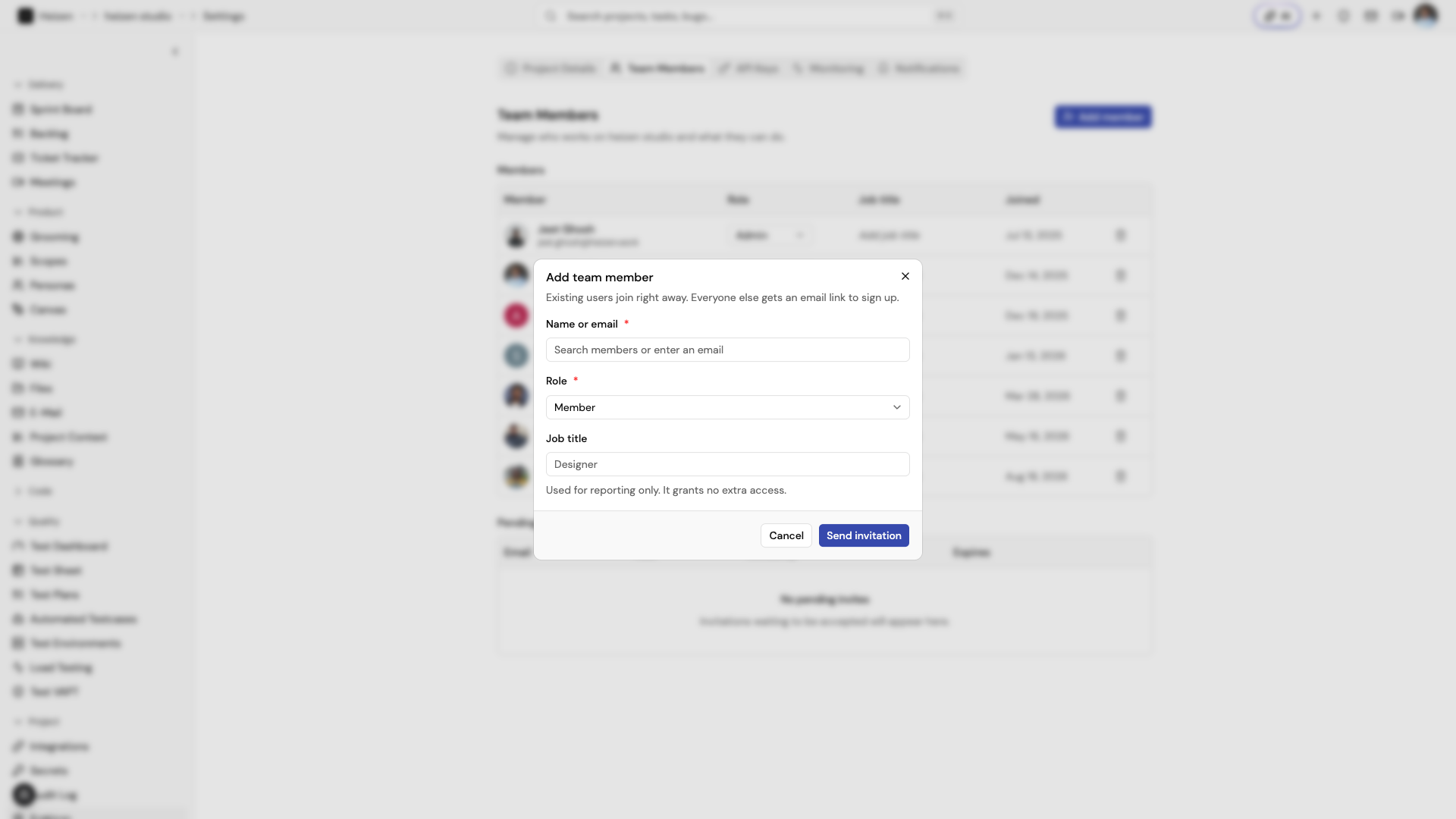 The Add team member dialog with a Name or email search field, Role selector, and Job title field.